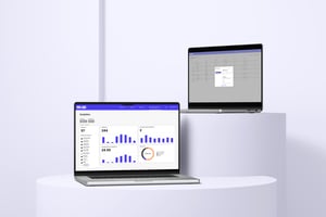Laptops on stands displaying the Nest and Owl 360 Services