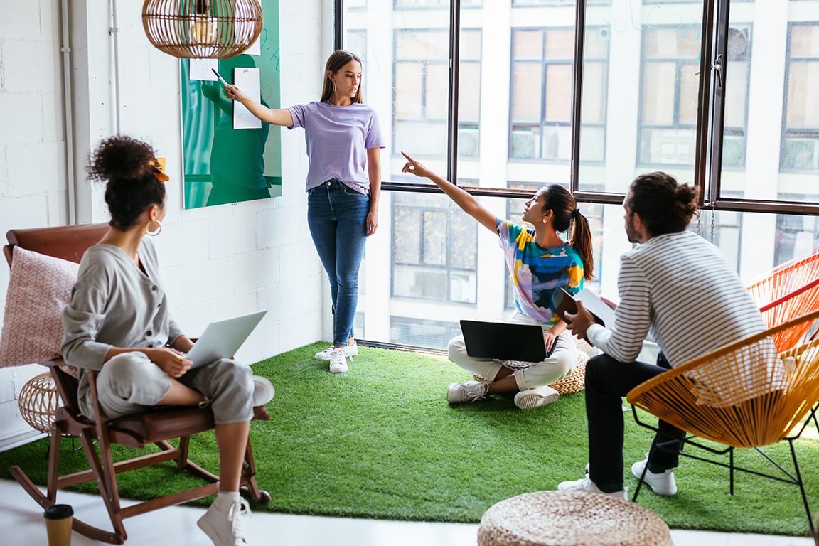 A team meeting in a bright meeting space. 